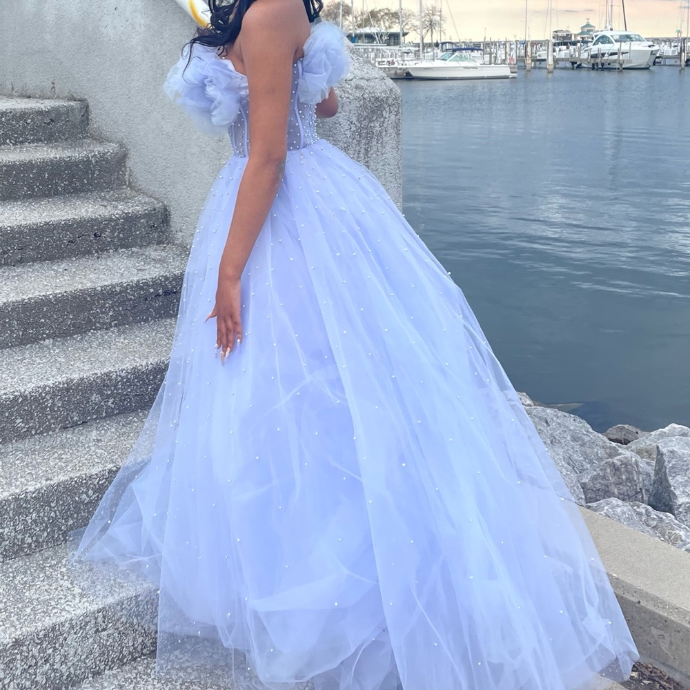 I’m selling a lavender corseted floor length prom dress.